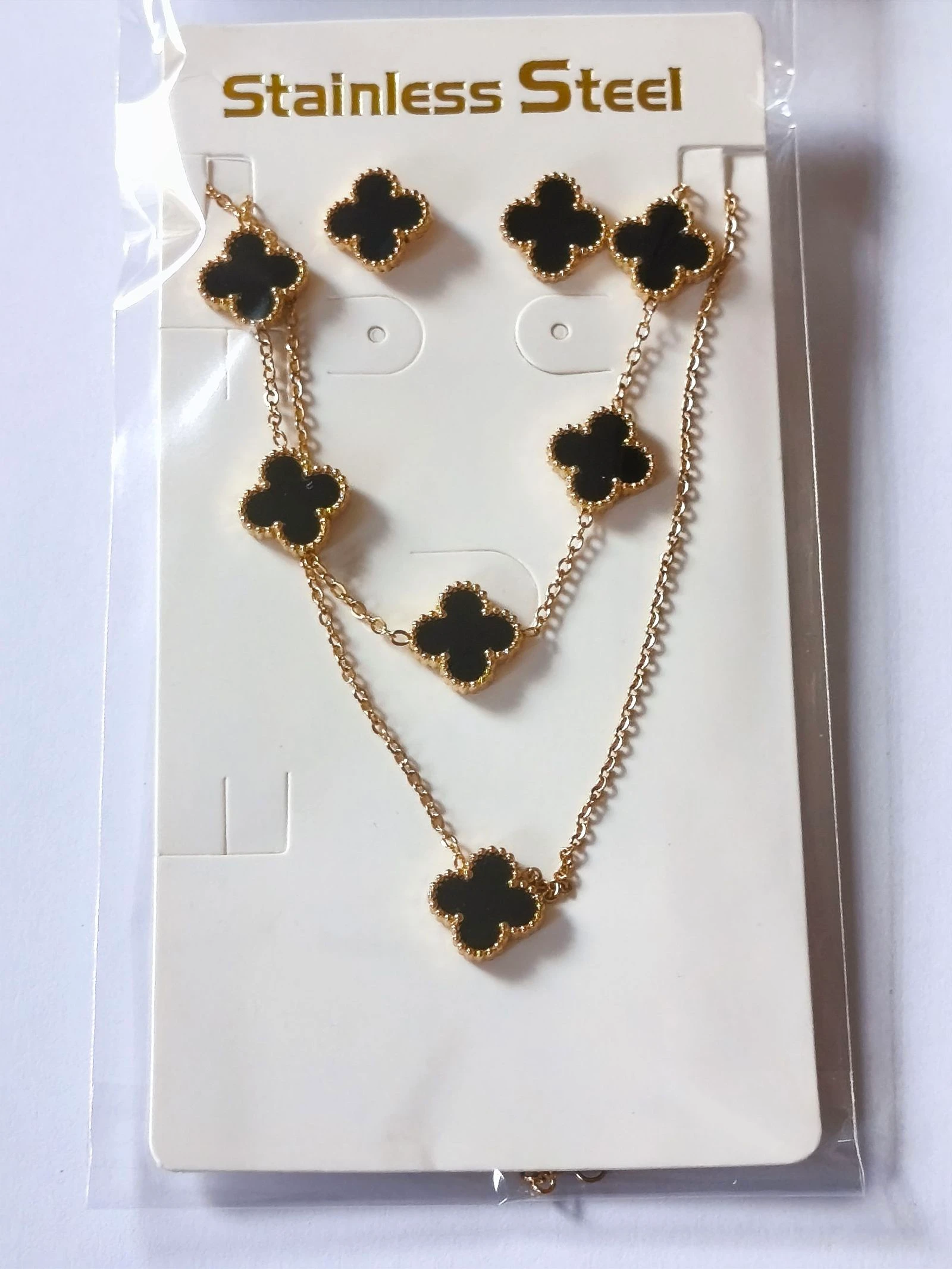 Set de gargantilla, pulsera y pendientes de trebol